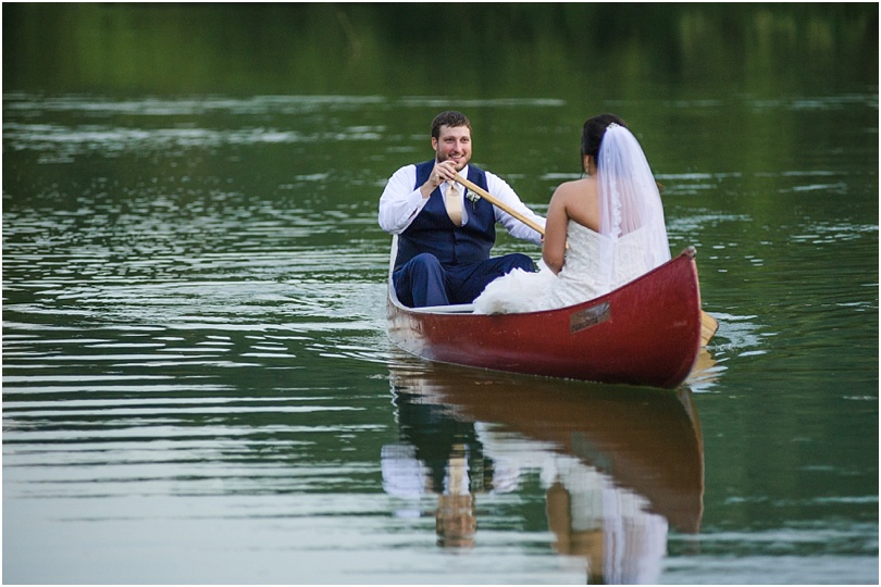 bride and groom out on a canoe on wedding day