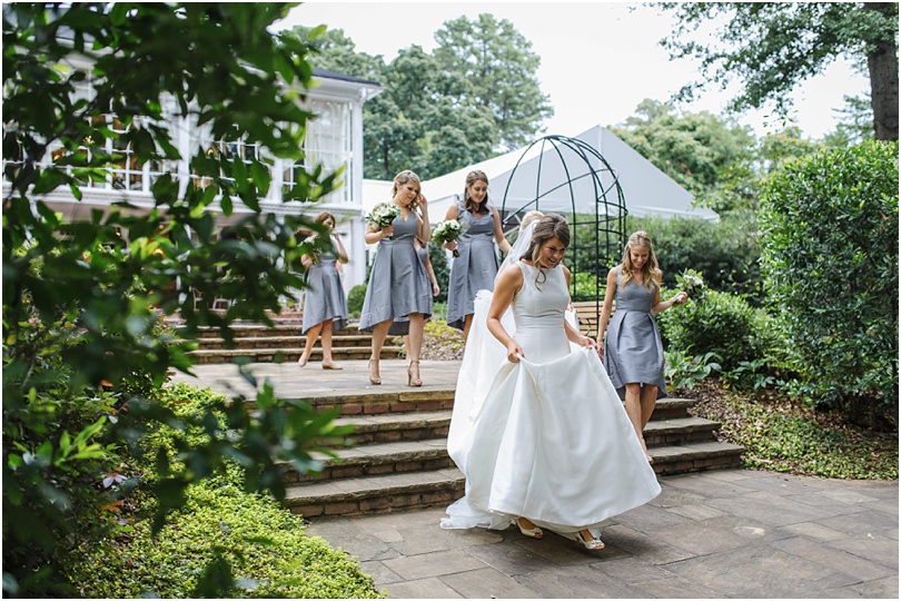 bridesmaids line walking through the estate courtyard
